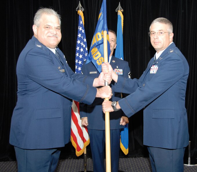 Lt. Col. Paul E. Smith, right, takes the guidon, and command, of the 442nd Medical Squadron from Col. Mark L. Clemons during a change of command ceremony Oct. 2 at Whiteman Air Force Base, Mo.  Colonel Smith replaced Col. Jerry Fenwick as the medical squadron's commander and will lead the 442nd MDS, which provides medical support to the Air Force Reserve's 442nd Fighter Wing.  Colonel Clemons is the 442nd Fighter Wing commander.  The 442nd Fighter Wing is an A-10 Thunderbolt II Air Force Reserve unit at Whiteman Air Force Base, Mo. (U.S. Air Force photo/Lt. Col. David Kurle)