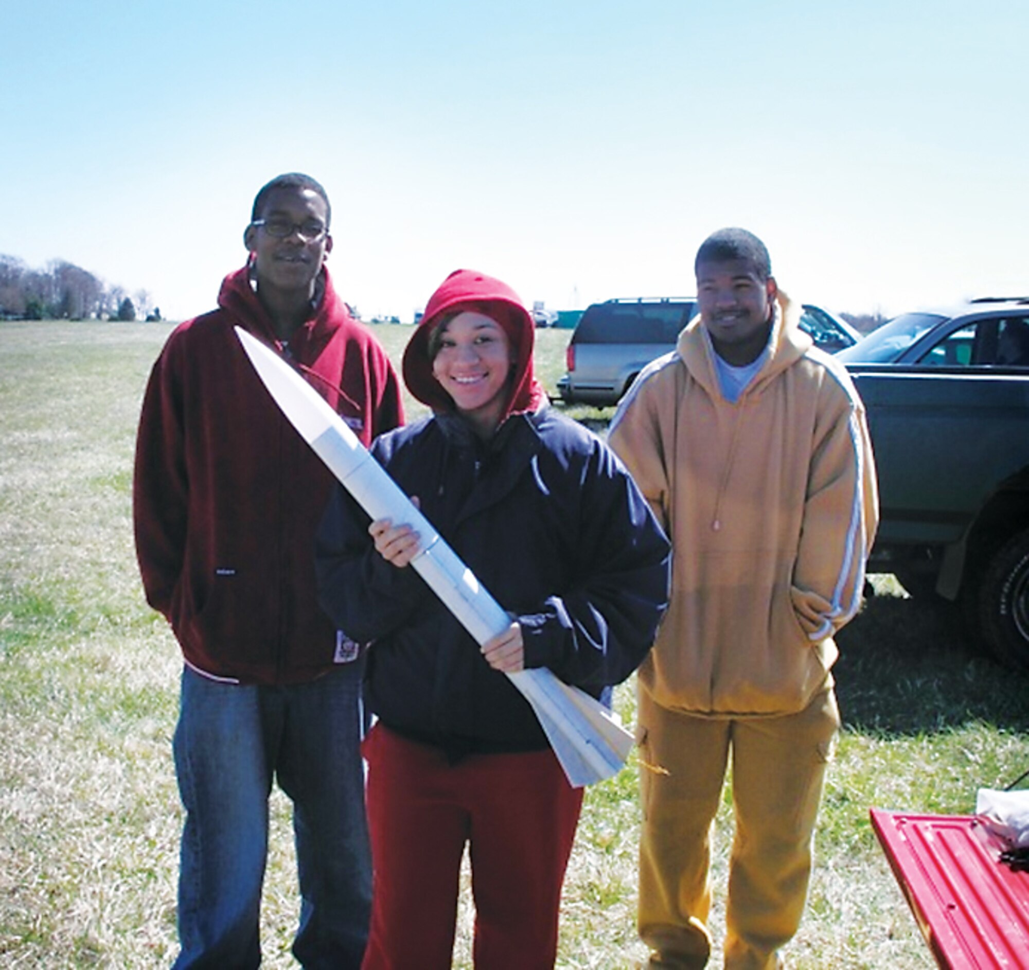 Students fly a remote-control aircraft, launch a rocket, and attend a robot competition. (AFRL image)