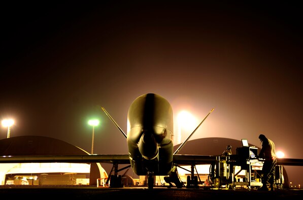 A maintenance technician checks the system as an RQ-4 Global Hawk gets ready for a mission while deployed Nov. 23, 2010, at an air base in Southwest Asia. The RQ-4 and Airmen are assigned to the Expeditionary Operations Group. (U.S. Air Force photo/Staff Sgt. Andy M. Kin)