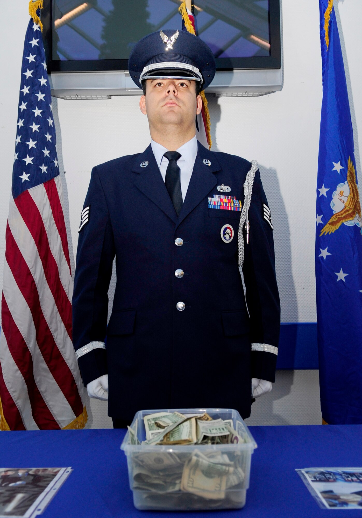 RAF MILDENHALL, England -- Staff Sgt. Alberto Emmons, RAF Mildenhall honor guardsman, stands at attention for the Armed Forces Veterans Homes Foundation Nov. 29, 2010. The RAF Mildenhall Honor Guard stood at attention in 30 minute increments to help raise money for the Foundation as part of the Combined Federal Campaign - Overseas. (U.S. Air Force photo/Senior Airman Ethan Morgan)