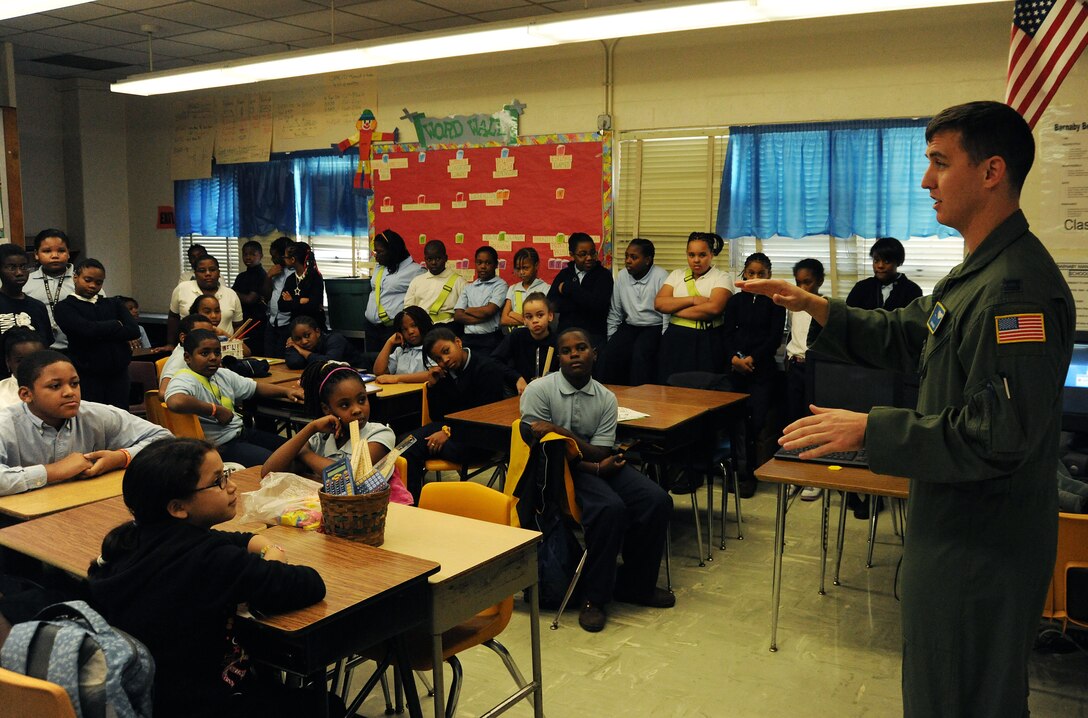 Captain Paul Bozzo, 1st Helicopter Squadron special missions pilot, shares his experience as a pilot with 5th grade students at Barnaby Manor Elementary School, Oxon Hill, Md, Nov. 18. The visit was part of the schools Community Day program, stressing the importance of doing well in school. Capt Bozzo spoke to more than 300 students ranging from pre-kindergarten through 5th grade and received hand-made ?thank you? cards for his visit. (U.S. Air Force Photo by 2nd Lt. Mark Flannery)
