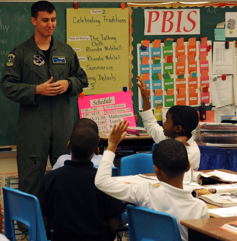 Captain Paul Bozzo, 1st Helicopter Squadron special missions pilot, shares his experience as a pilot with 3rd grade students at Barnaby Manor Elementary School, Oxon Hill, Md, Nov. 18. The visit was part of the schools Community Day program, stressing the importance of doing well in school. Capt Bozzo spoke to more than 300 students ranging from pre-kindergarten through 5th grade and received hand-made ?thank you? cards for his visit. (U.S. Air Force Photo by 2nd Lt. Mark Flannery)
