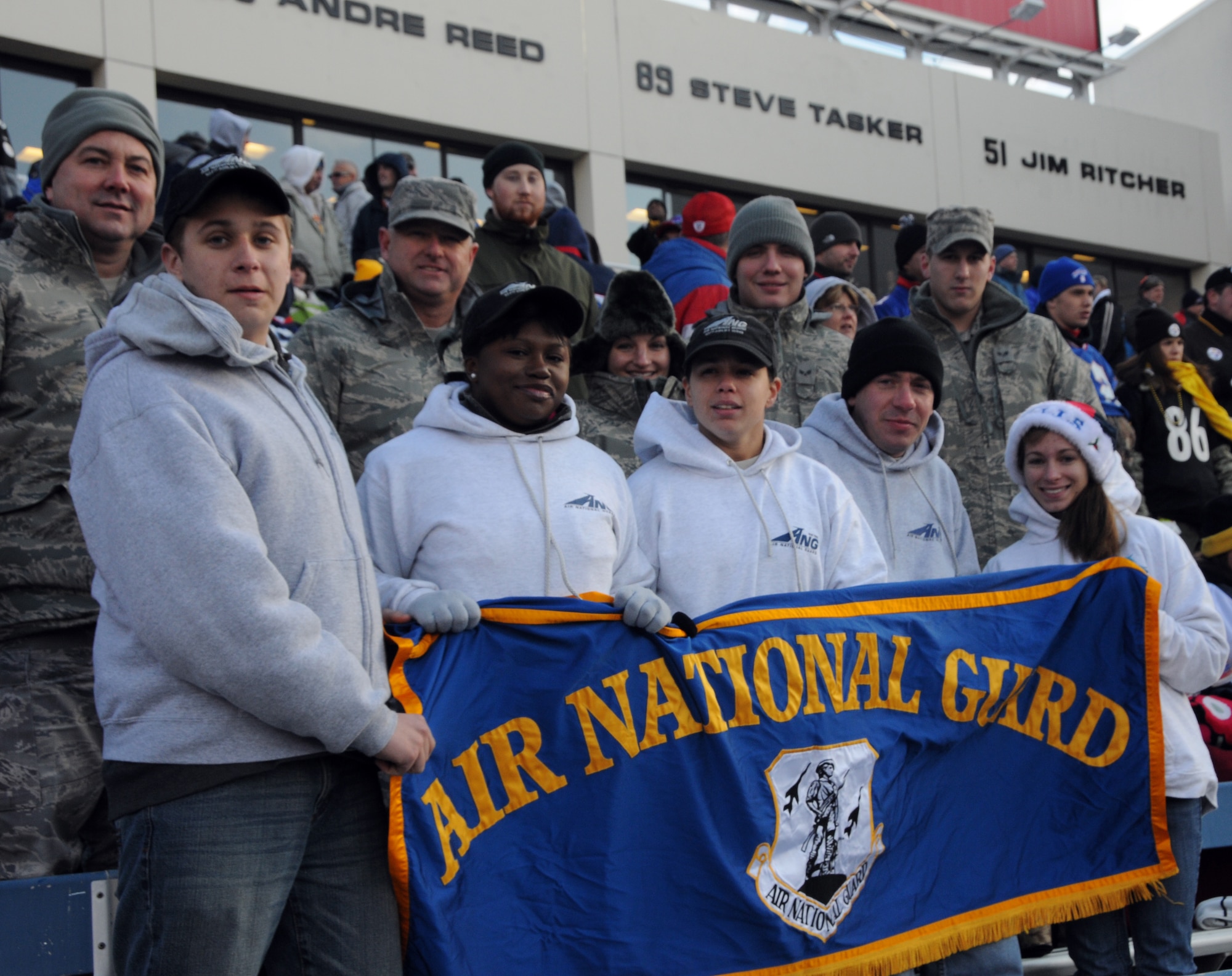 During Sunday's Buffalo Bills/Pittsburg Steelers game, the newest New York Air National Guard's 107th Airlift Wing enlistees (in the front row) took part in a pregame enlistment ceremony held on the Buffalo Bills field. After the ceremony the enlistees were joined by existing unit members to cheer on the Bills. Front row left to right, Airmen 1st Class Daniel Treblett, Christina Swanson, Cara Sturdivant and Joanna Vail. Back row left to right, Tech. Sgt. Patrick Paolini, Staff Sgt. Peter Dean, Tech. Sgt. Charity Edwards, Senior Airmen Robert Kurzdorfer and Paul Boser. (U.S. Air Force Photo/Tech. Sgt. Justin Huett)