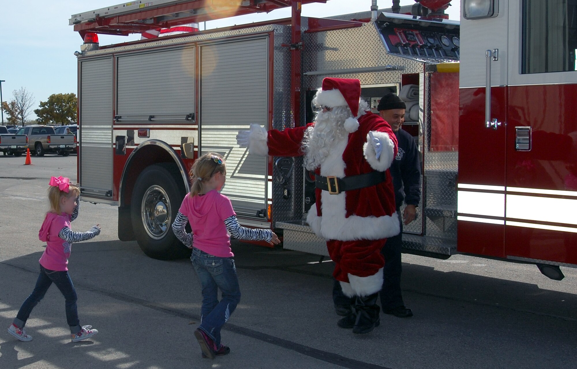 GOODFELLOW AIR FORCE BASE, Texas - Santa Claus comes to town on a big red fire engine at Goodfellow Nov. 20.  The base hosted a Community Appreciation Day and Santa's Workshop open to the local community. Santa came to take photos with youths.  (U.S. Air Force photo/Staff Sgt. Heather Rodgers)