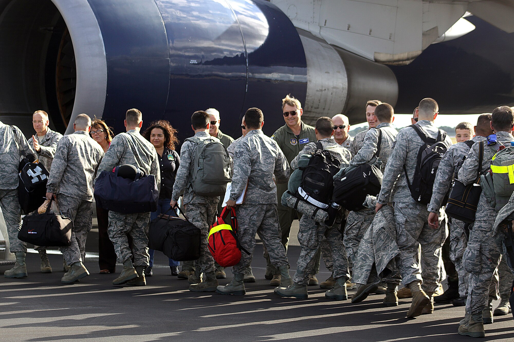Senior military leaders from the 482nd Fighter Wing and local government officials say goodbye to Air Force Reservists as they board a charter aircraft destined for South Korea at Homestead Air Reserve Base on Nov. 28.  The deployment of Airman to the Korean peninsula is part of a routine Theater Security Package training rotation to the Asia-Pacific region. (U.S. Air Force photo/Tim Norton) 