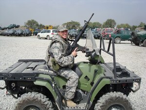 KABUL, Afghanistan -- 1st Lt. Yvonne Nollman, deployed to Afghanistan from the 633d Logistics Readiness Squadron, poses for a photo aboard an all-terrain vehicle while on patrol Aug. 17. Lieutenant Nollman is scheduled to return from Afghanistan in January 2011. (Courtesy photo)