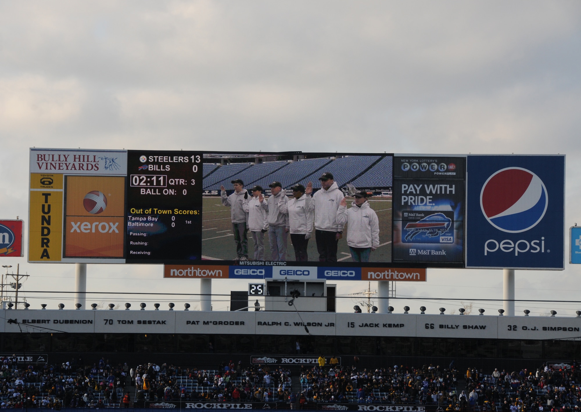 During a Buffalo Bills pregame ceremony held Sunday morning, six of the newest members of the New York Air National Guard's 107th Airlift Wing took the Oath of Enlistment. The ceremony was played during halftime on the Jumbotron for the fans to see.  Lt. Col. James Hoch swears in from left to right Airmen 1st class Daniel Tremblett, Cara Sturdivant, Keith McArthur, Christina Swanson, Joshua Velez and Joanna Vail.  (U.S. Air Force photo/Staff Sgt. Peter Dean)
