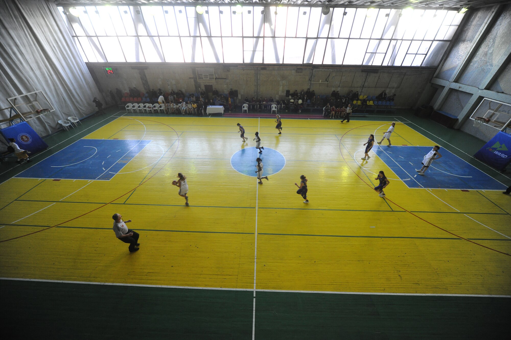 BISHKEK, Kyrgyzstan - 2nd Lt. Rachel Emory, 376th Expeditionary Civil Engineer Squadron, runs the ball down the court during a basketball game against the Kyrgyz National University at the Kyrgyz Sports Palace in Bishkek, Nov. 27.  The Transit Center team defeated the Kyrgyz National Women's Team with a final score of 63-49.  (U.S. Air Force photo/Staff Sgt. Nathan Bevier)