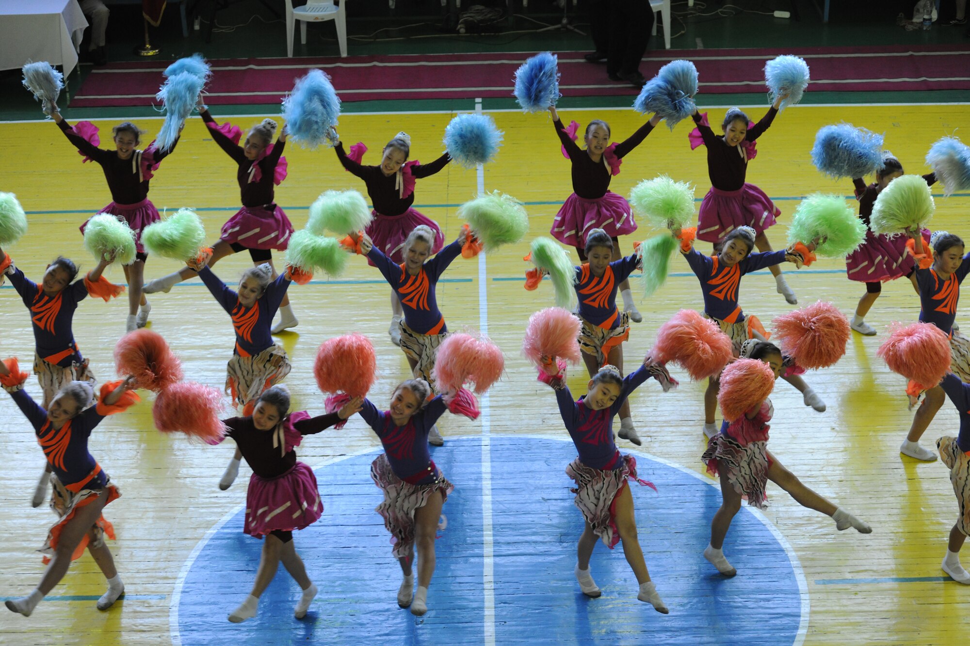 BISHKEK, Kyrgyzstan - Kyrgyz dance group Shattyk perform for the half-time show during a basketball game at the Kyrgyz Sports Palace in Bishkek, Nov. 27.  The Transit Center team defeated the Kyrgyz National Women's Team with a final score of 63-49.  (U.S. Air Force photo/Staff Sgt. Nathan Bevier)