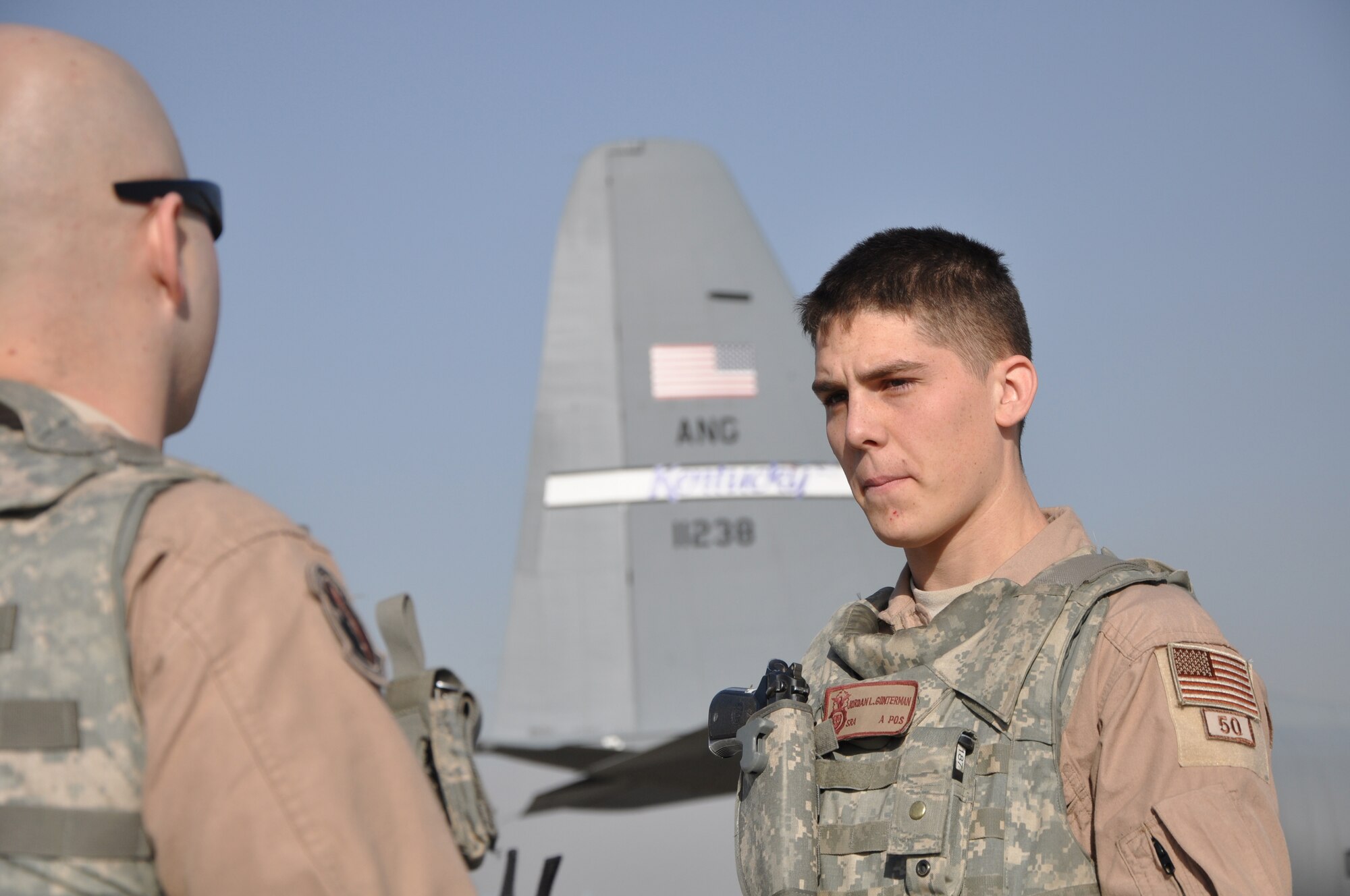 Senior Airman Jordan Gunterman (right), a 379th Air Expeditionary Wing fly away security team leader, discusses base security with his wingman Senior Airman Kailan Smith at Bagram Airfield, Afghanistan.  (U.S. Air Force Photo/Capt. Erick Saks)