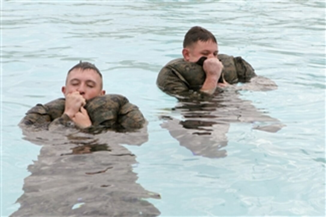 Marines with the 11th Marine Expeditionary Unit participate in swim qualification training at Camp Pendleton, Calif., on Nov. 24, 2010.  Swim qualifications contribute to the readiness and effectiveness of Marine units in a combat environment.  