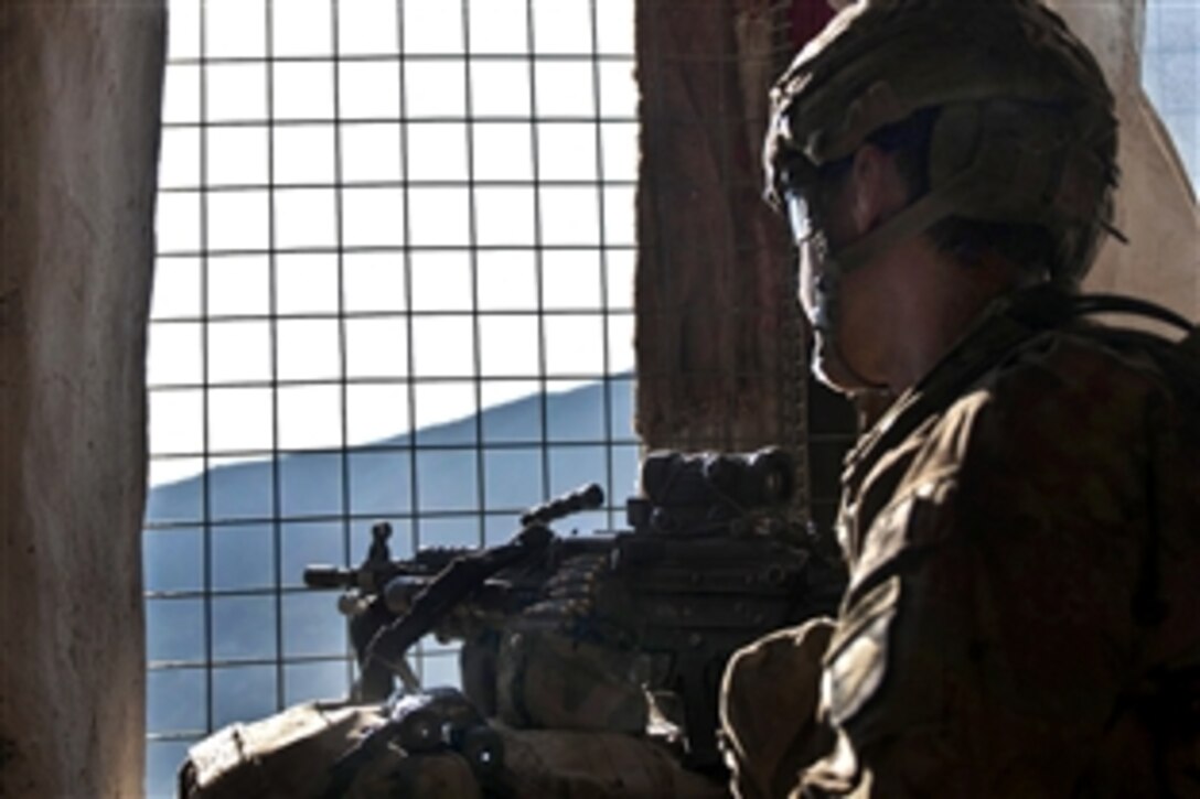 U.S. Army Pfc. Chris J. Nielsen takes a planned rest break from standing guard at a window during a joint clearing operation in the Pech River Valley in eastern Afghanistan's Kunar province, Nov. 25, 2010. Nielson, an M249 squad automatic weapon gunner, is assigned to Company B, 1st Battalion, 327th Infantry Regiment, Task Force Bulldog.