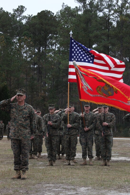 Sgt. Maj. William R. Sweet salutes during the National Anthem at Marine Air Control Squadron 2’s post and relief ceremony at the MACS-2 parade field Dec. 1. Sgt. Maj. Alex M. Dobson assumed duties as sergeant major of Marine Air Control Squadron 2 from Sweet.