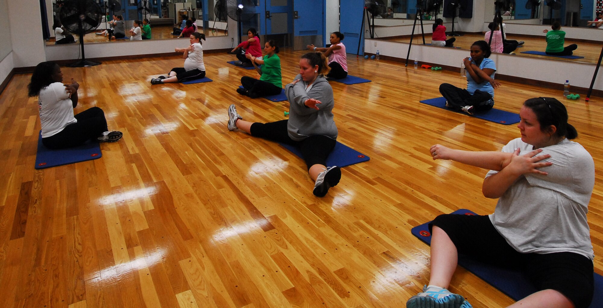 YOKOTA AIR BASE, Japan -- Future moms do cool-down stretches in the prenatal class taught by Staff Sgt. Treshawna Gwendo, diet therapist at the 374th Aerospace Medicine Squadron. 'Fit Moms' is a prenatal class offered at Yokota's Health and Wellness Center, Tuesdays and Thursdays from 3:30 to 4:30 p.m. (U.S. Air Force photo/Airman 1st Class Lynsie Nichols)
