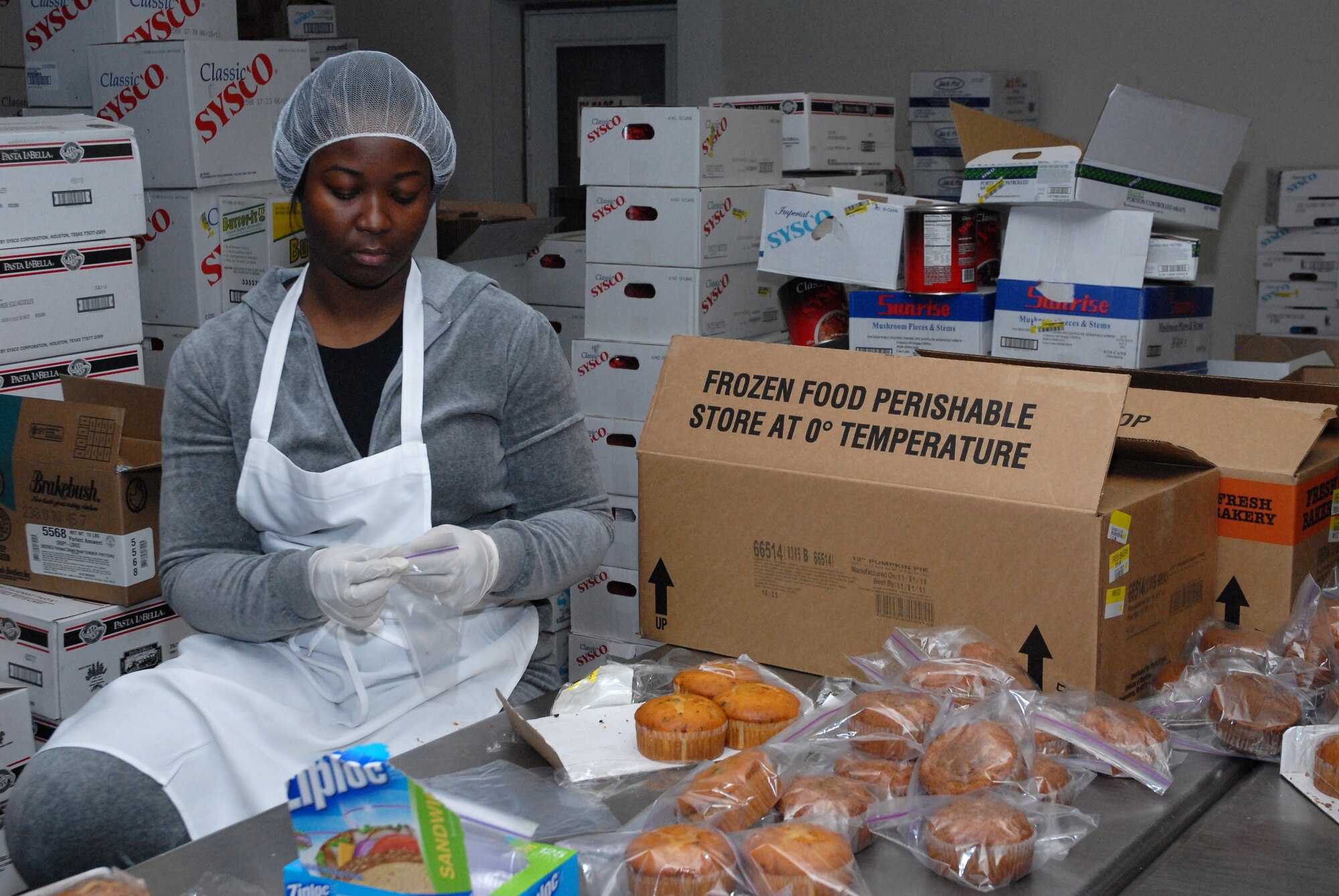 Staff Sgt. Latosha Tibbs, 341st Force Suppot Squadron NCO in charge of career development, bags muffins Nov. 24 at Great Falls Meals on Wheels in preperation for Operation Thanksgiving. Sergeant Tibbs and 46 other Airmen prepared and delivered 370 meals to elderly and less fortunate members of the local community. (U.S. Air Force photo/Staff Sgt. Dillon White)