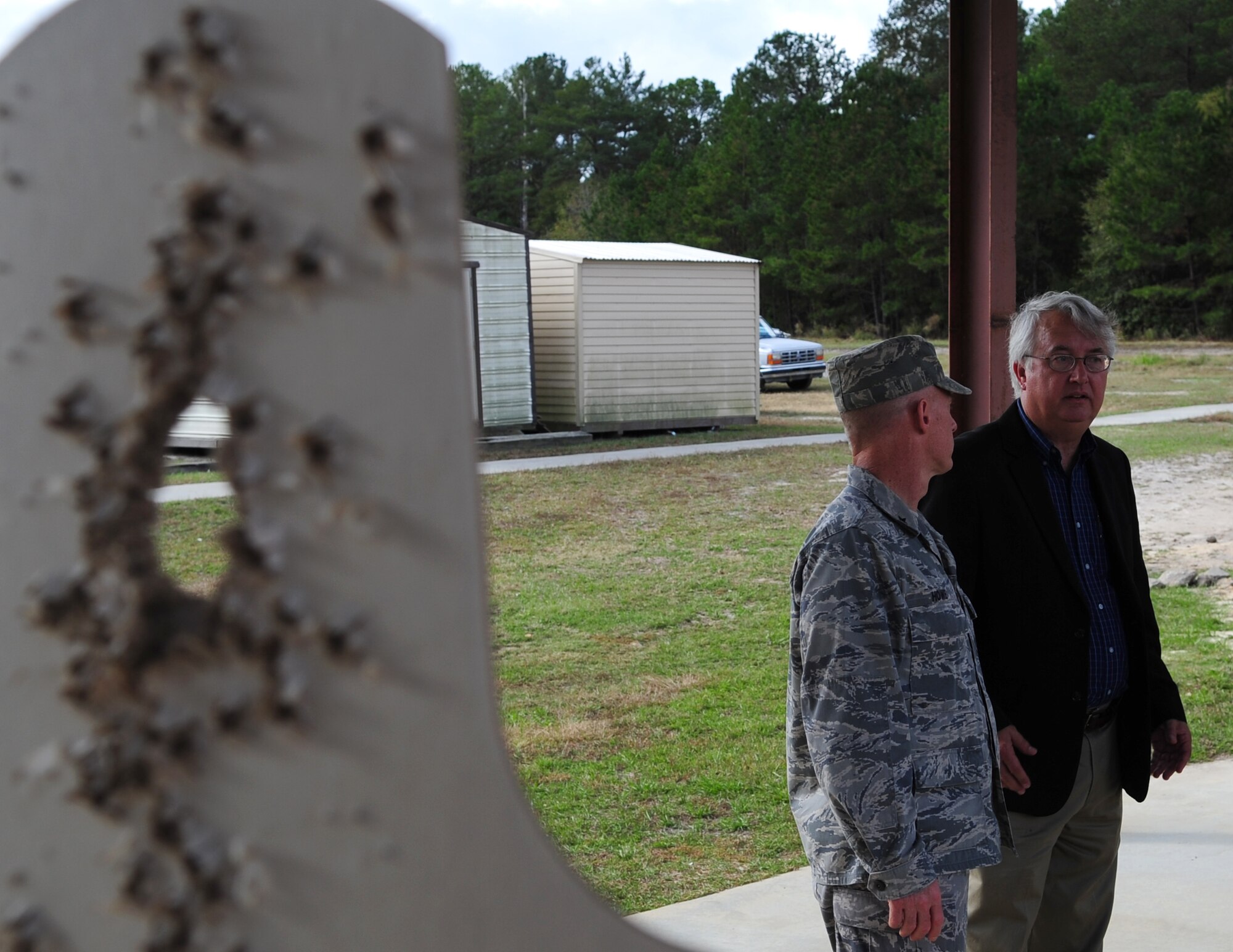 MOODY AIR FORCE BASE, Ga. --Brig. Gen. Dave Howe, Director of Installations and Mission Support, Headquarters Air Combat Command, asks Mr. Williams Bryan, 23rd Civil Engineer Squadron programs flight chief, questions about the old combat arms training maintenance site Nov. 30. General Howe visited the old CATM site to see the conditions of the firing range and the status of the new one. (U.S. Air Force photo/Senior Airman Stephanie Mancha)(RELEASED)