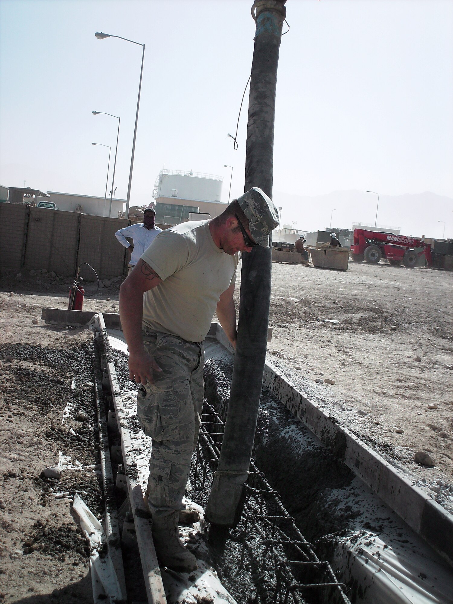Senior Airman Wesley Espinoza, 419th Civil Engineer Squadron, pours footers for new billeting units at Bagram Airfield, Afghanistan. (Courtesy photo)