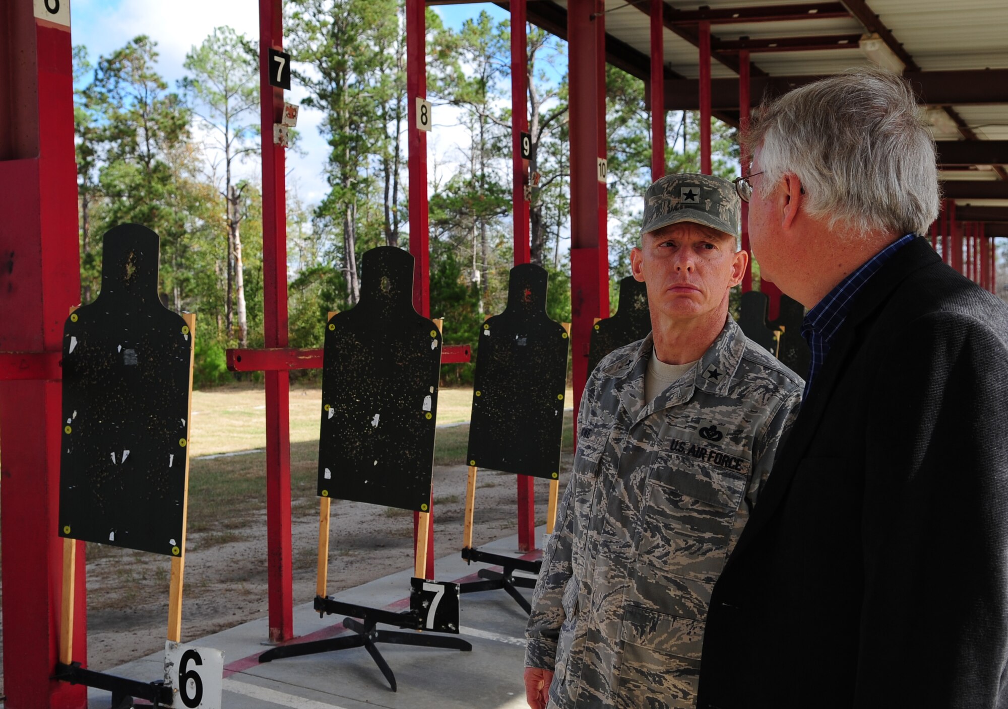 MOODY AIR FORCE BASE, Ga.-- Mr. Williams Bryan, 23rd Civil Engineer Squadron programs flight chief, shows Brig. Gen. Dave Howe, Director of Installations and Mission Support, Headquarters Air Combat Command, the old combat arms training maintenance site Nov. 30. General Howe visited the old CATM site to see the conditions of the firing range and the status of the new one. (U.S. Air Force photo/Senior Airman Stephanie Mancha)(RELEASED)