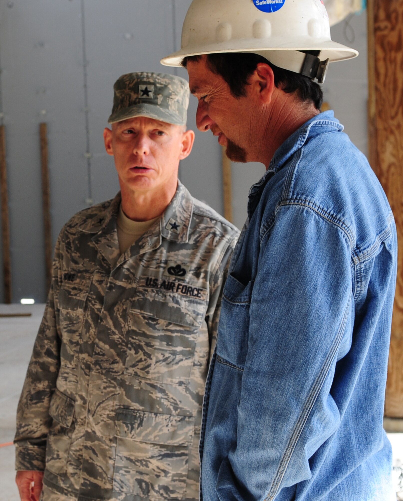 MOODY AIR FORCE BASE, Ga.-- Brig. Gen. Dave Howe, Air Combat Command director of installations and missions support, meets with Luis Rumph, contractor, during his tour of the ongoing construction site at the new combat arms training and maintenance firing range Nov. 30. The firing range is one of the many stops made during his visit on base. (U.S. Air Force photo/Senior Airman Stephanie Mancha)(RELEASED)
