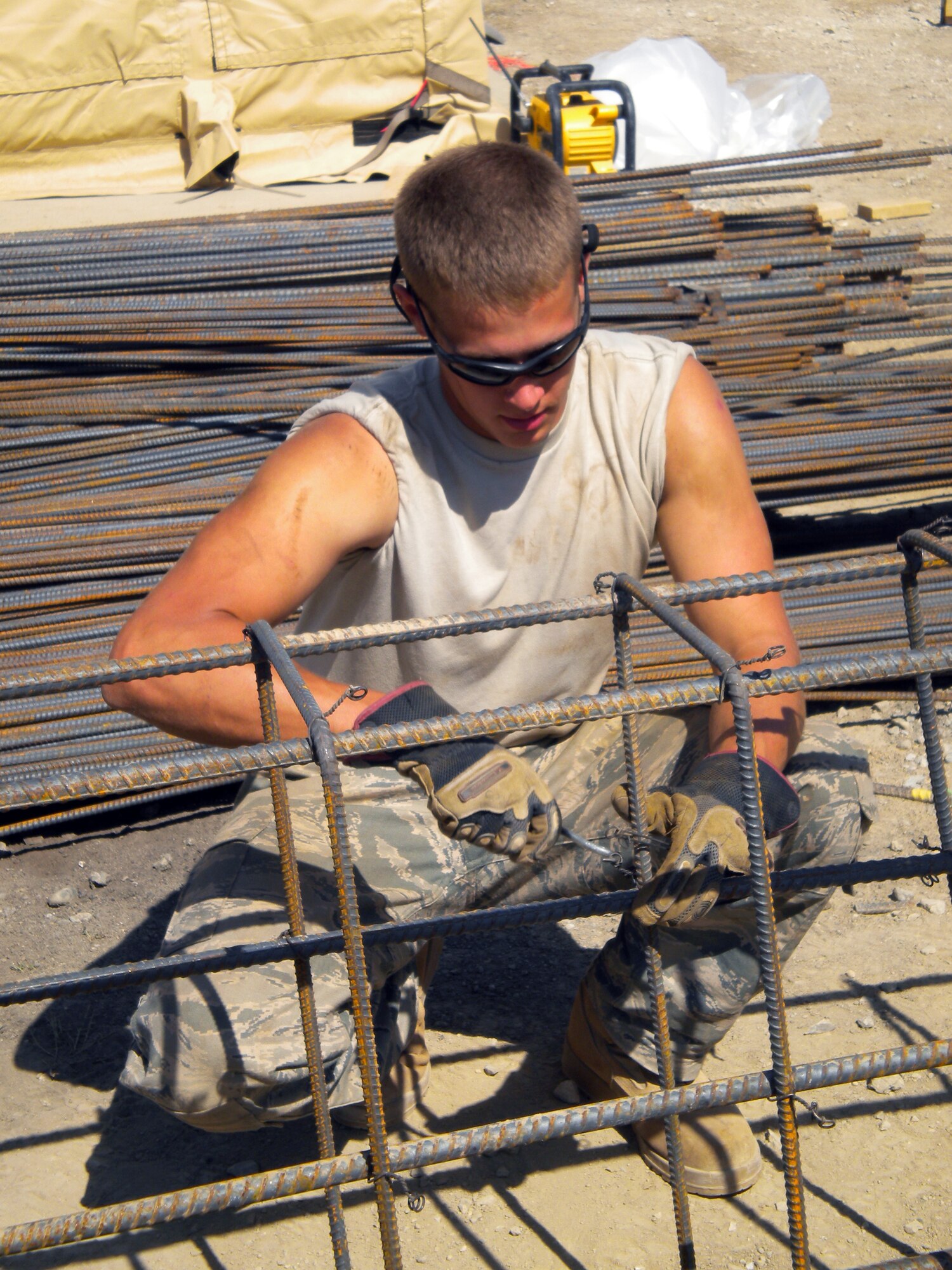 Senior Airman Timothy Stoneman, 419th Civil Engineer Squadron, braves the heat to help build new billeting units in Bagram Airfield, Afghanistan. (Courtesy photo)