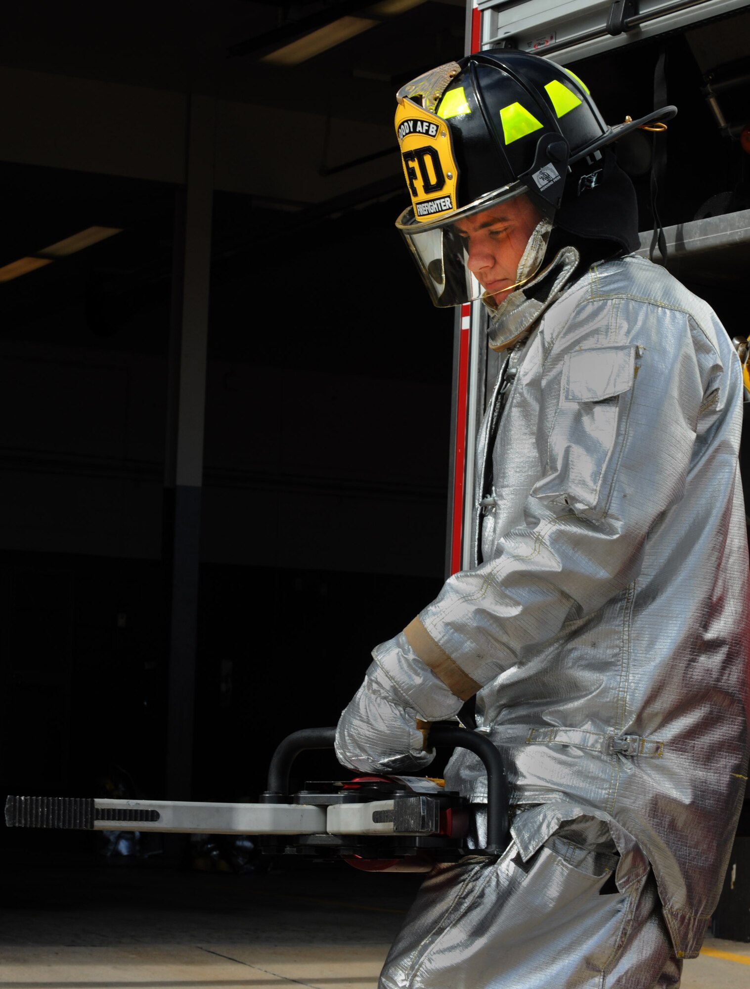 MOODY AIR FORCE BASE, Ga. -- Airman 1st Class Gary Simmons Jr., 23rd Civil Engineer Squadron firefighter, tests out a spreader Nov. 22.  The tool is used with a cutter to help pry open parts of a vehicle and free any trapped victims. This past year, the 23rd CES responded to 196 aircraft, medical and structural calls, earning them the 2010 Society of American Military Engineers Curtin Award for best small unit in Air Combat Command during a recent awards banquet at Langley Air Force Base, Va. (U.S. Air Force photo/Airman 1st Class Douglas Ellis)(RELEASED)