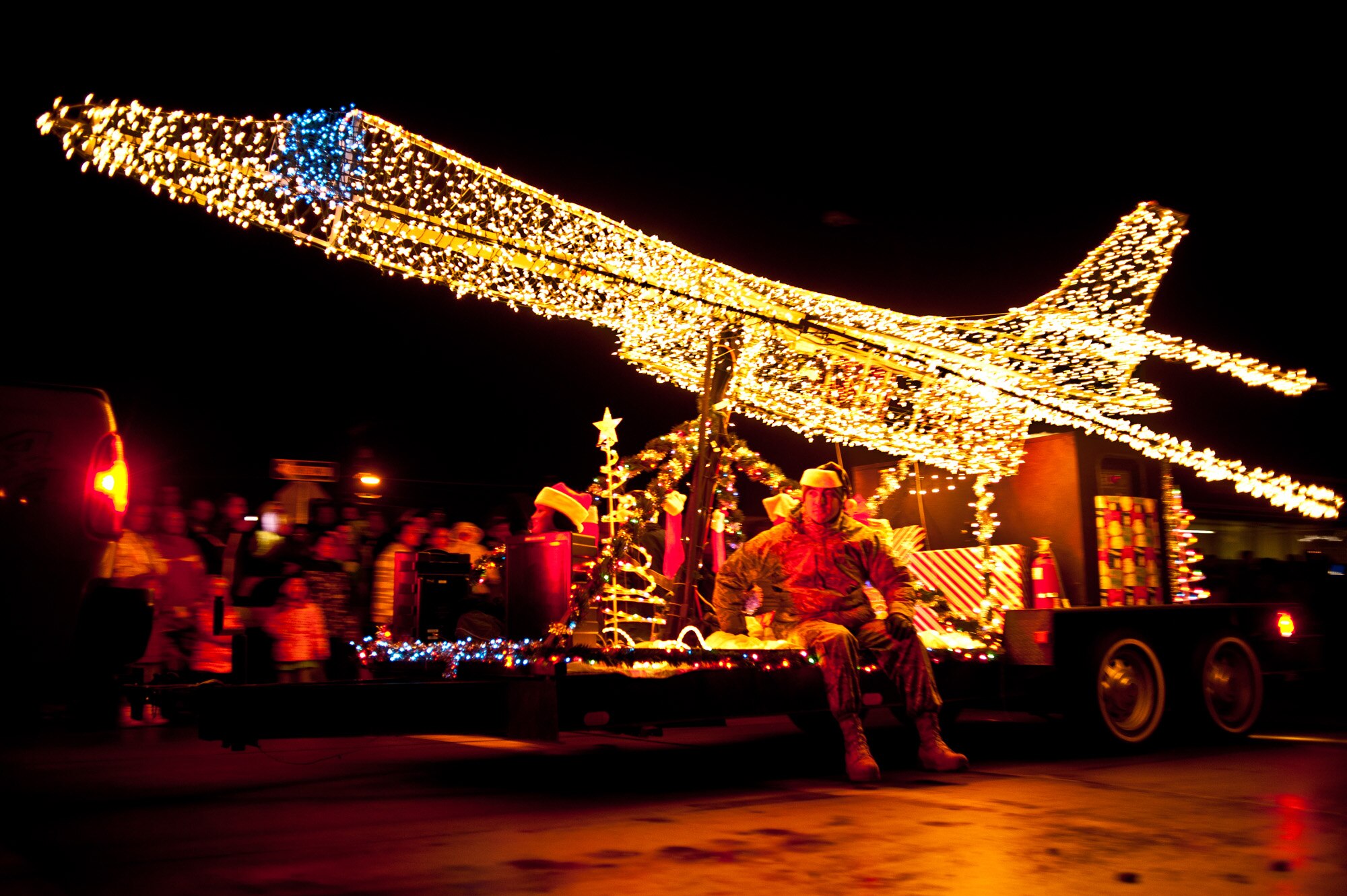 ELLWORTH AIR FORCE BASE, S.D. – The Ellsworth AFB float is towed down St. Joseph Street in Rapid City, S.D., Nov. 27 during the Festival of Lights parade. The base has participated in the parade for most of its 13-year history, and has won many awards including the Razzle Dazzle award in 2009 and the Community Spirit award in 2010. (U.S. Air Force photo/Tech. Sgt. Nathan Gallahan)