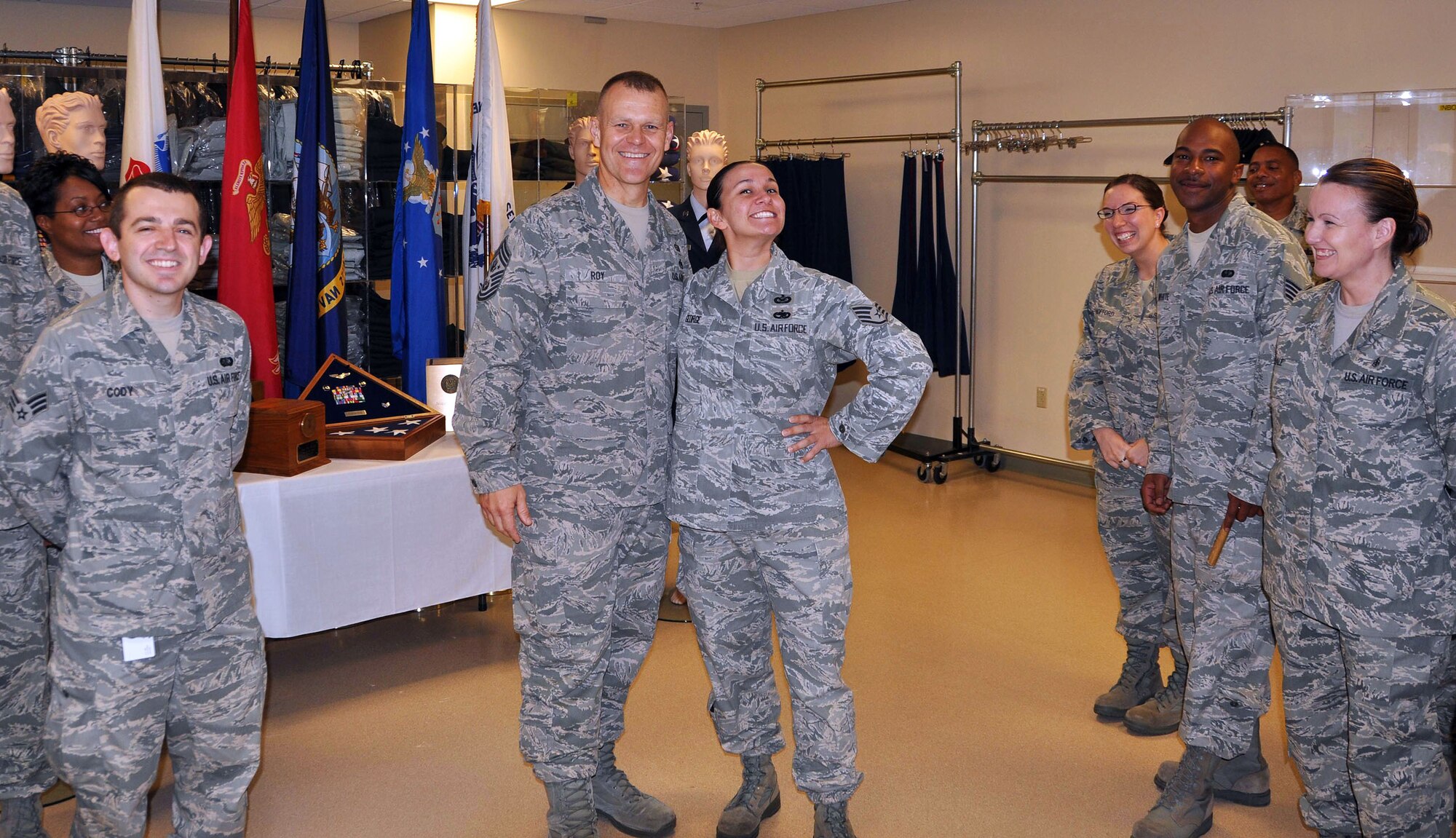 TRAVIS AIR FORCE BASE, Calif. -- Chief Master Sergeant of the Air Force James Roy, center, recently made a visit to the team at the Air Force Mortuary Affairs Operations Center, Dover Air Force Base, Del. The 349th Memorial Affairs Squadron has consistently deployed Airmen to the Center to support port mortuary operations, including the dignified transfer of remains arriving from the theater of operations. One of the wing's Airmen supporting them during the holiday season is Senior Amn. Gregory Cody, pictured on the far left here. Airman Cody is also the 349th MAS unit historian. (U.S. Air Force photo/Staff Sgt. Jamie George)