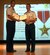 Lt. Col. Randall Huiss, right, is awarded the Bronze Star by Col. Robert Holba at the base theater on Joint Base Charleston, S.C., Nov. 23, 2010, for his meritorious service while deployed as the 816th Expeditionary Airlift Squadron commander, 385th Air Expeditionary Group, supporting ground and air operations against the enemy at an undisclosed location in the Middle East from Dec. 27, 2009, to May 3, 2010. Under his command the 816 EAS executed the largest C-17A combat airdrop effort to date, which included emergency resupply of ammunition and supplies to troop-in-contact with enemy forces. He also the led the unit for the first-ever C-17A global positioning system-guided combat airdrop with the ?Firefly? system and the first formation combat airdrop from the EAS construct. Colonel Huiss? leadership enabled the safe execution of more than 3,100 sorties, 8,000 flying hours and delivery of more than 148 million pounds of cargo and 37,000 passengers. Colonel Holba is the 437th Operations Group commander, and Colonel Huiss is the 14th Airlift Squadron commander.