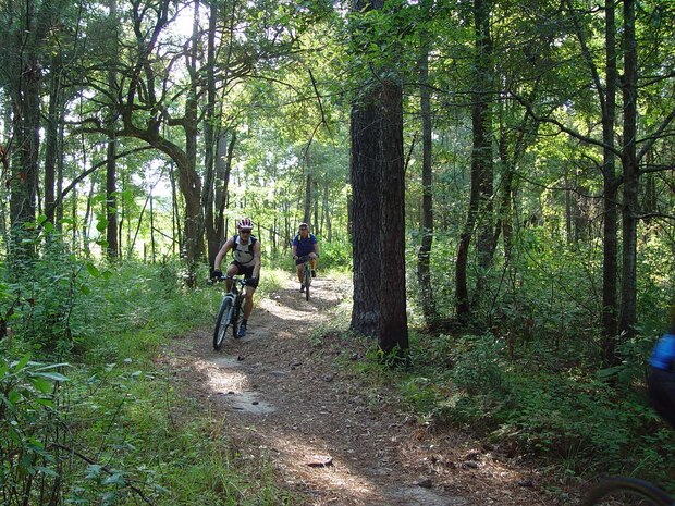 Off-road bikers race along the Marrington Trails on Joint Base Charleston-Weapons Station, S.C. The Charleston International Airport trains its bicycle officers on the trail system, the College of Charleston introduces new students to trail riding there, and annual National Public Lands Day events host volunteers in organized trail maintenance activities. (Courtesy photo)