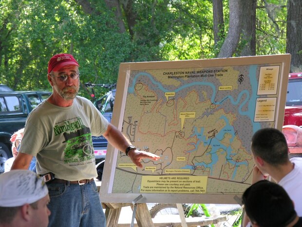 Natural Resources Technician Don Watts gives a presentation as organizer of an off-road bike race at the Marrington Plantation Outdoor Recreation area on Joint Base Charleston-Weapons Station, S.C. Mr. Watts was selected Nov. 16, 2010, by the American Trails Foundation for the 2010 National Trail Worker Award for his long standing efforts in support of the Marrington Trail System. (Courtesy photo)