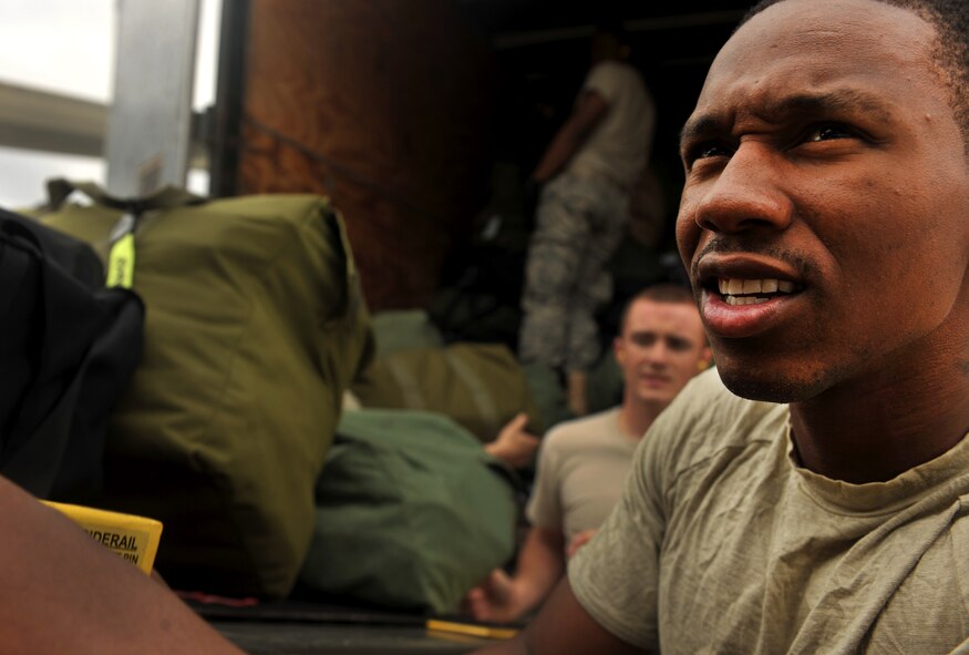 MOODY AIR FORCE BASE, Ga.--  Airman 1st Class Mathis Williams, 824th Base Defense Squadron fire team member, loads bags onto a conveyer belt during a recent deployment. The Airmen who weren’t deploying helped load bags and equipment onto the aircraft, showing dedication and support for their deployed members. (U.S. Air Force photo/Airman 1st Class Joshua Green)(RELEASED)
