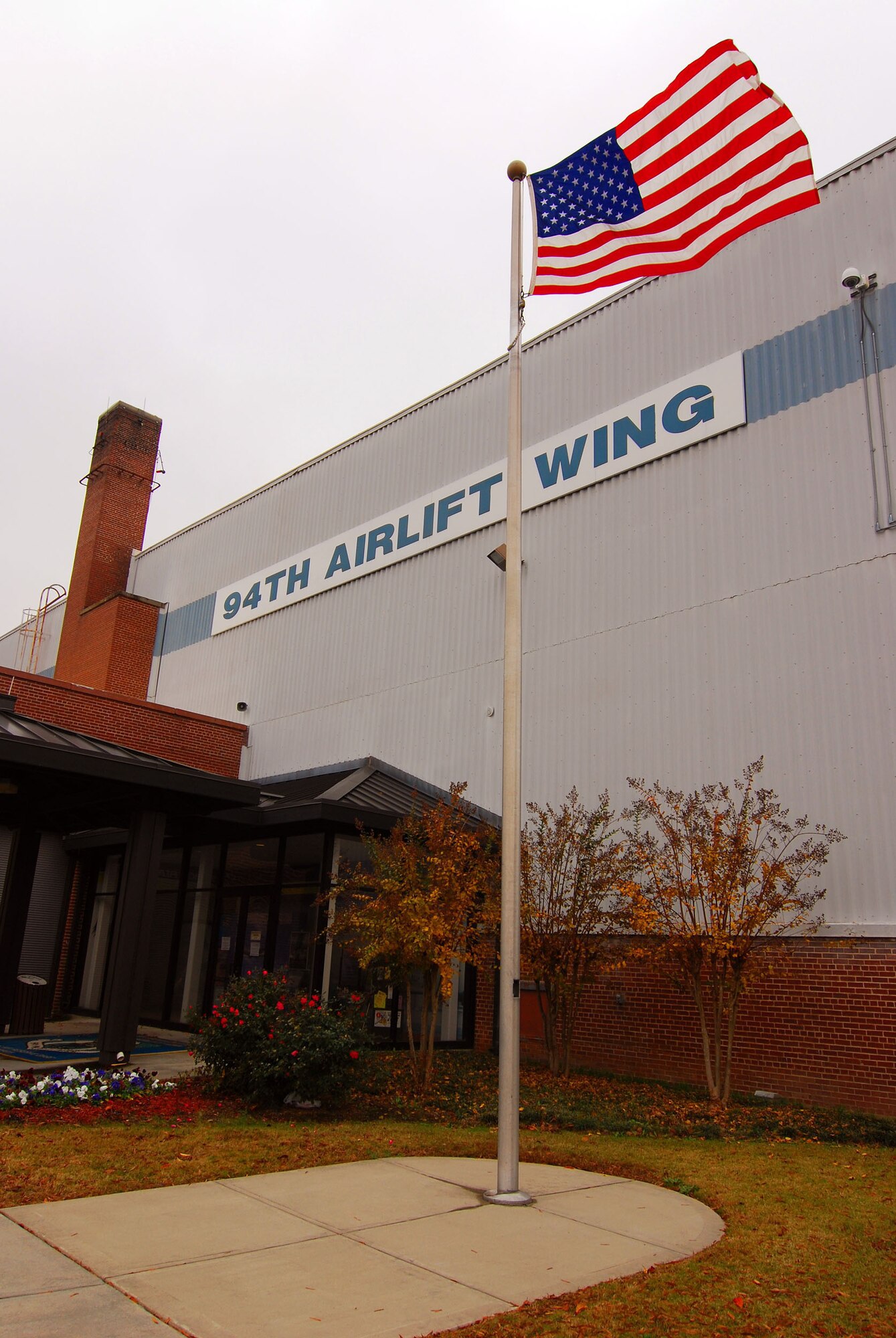 The US flag flies at the 94th Airlift Wing headquarters building at Dobbins Air Reserve Base, Marietta Ga. on 24 Nov.  (U.S. Air Force photo/ Brad Fallin)