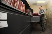 MINOT AIR FORCE BASE, N.D. -- Airman 1st Class Frances Jimenez, 5th Medical Operations Squadron mental health technician, cycles through the personnel reliability program files in the record room here Nov. 23. The mental health clinic at the 5th Medical Group supports the men and women of the 5th Bomb Wing and 91st Missile Wing making sure they are mentally ready for duty. (U.S. Air Force photo/Airman 1st Class Aaron-Forrest Wainwright)