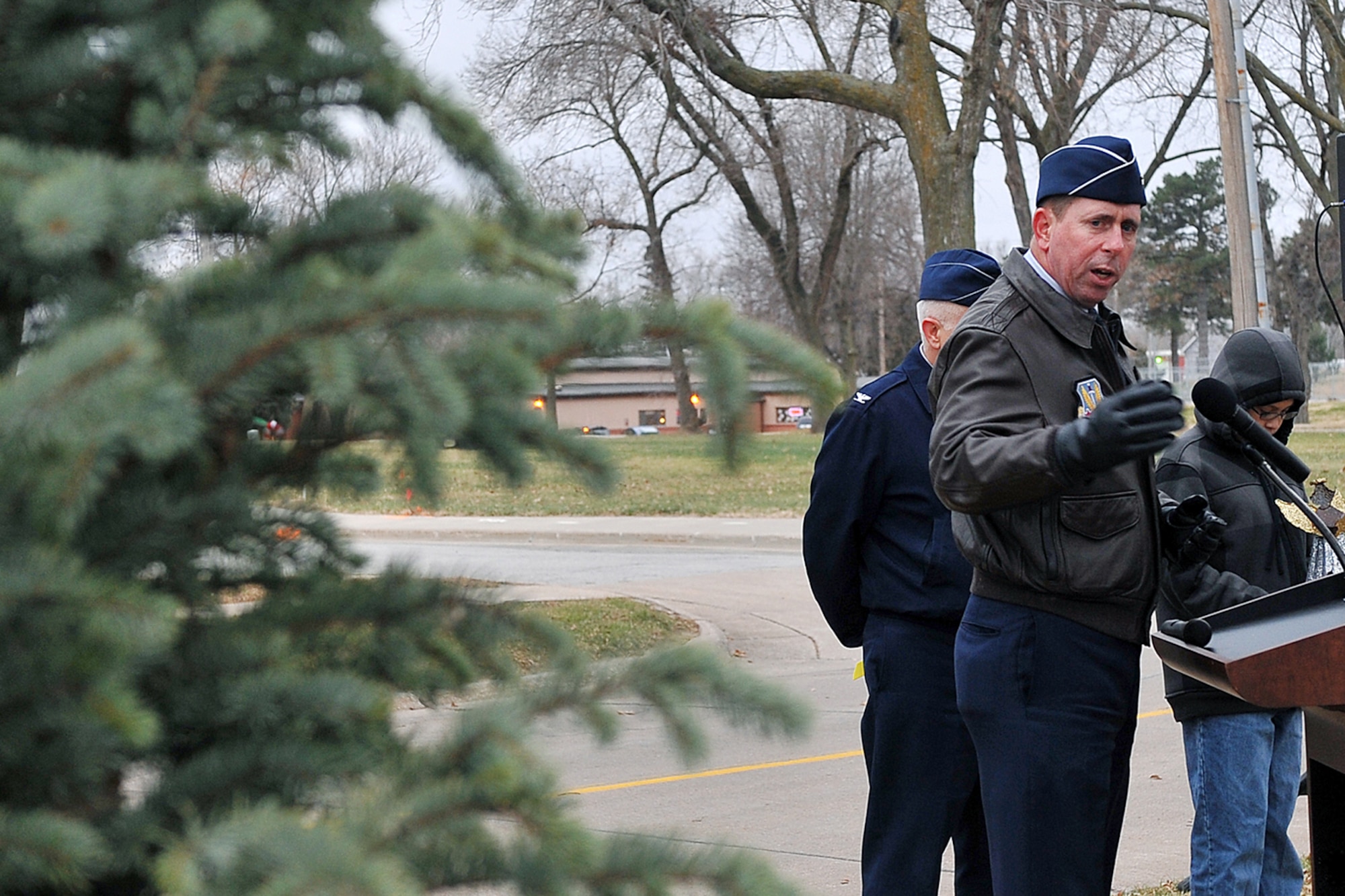 OFFUTT AIR FORCE BASE, Neb. - Brig. Gen. John N.T. Shanahan, 55th Wing commander, addresses the audience in front of the hero tree at Offutt's new Hero Park outside the SAC Memorial Chapel during a special dedication ceremony Nov. 29. Team Offutt will be able to gather at the hero tree to meditate, reflect on and pray for their deployed love ones. U.S. Air Force photo by Charles Haymond (Released)