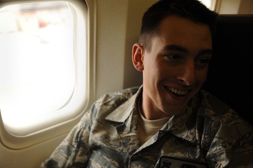 MOODY AIR FORCE BASE, Ga.-- Airman 1st Class Roger Perose, 824th Base Defense Squadron fire team member, has a laugh before deploying. Members from the 824th BDS were seated by flights to ensure all personnel were boarded before take-off. (U.S. Air Force photo/Airman 1st Class Benjamin Wiseman)(RELEASED)