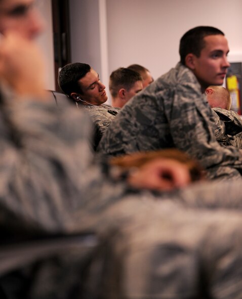 MOODY AIR FORCE BASE, Ga.-- Members of the 824th Base Defense Squadron wait for their aircraft to be loaded. The 824th BDS members recently spent their time playing video games, cards and taking naps while waiting for their aircraft to land. (U.S. Air Force photo/Airman 1st Class Benjamin Wiseman)(RELEASED)