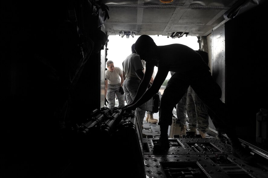 MOODY AIR FORCE BASE, Ga.-- Members from the 822nd Base Defense Squadron recently loaded weapons into the belly of a Boeing 757 aircraft. The 822nd BDS worked in conjunction with the 23rd Logistics Readiness Squadron to ensure all weapons and cargo was successfully loaded onto the aircraft. (U.S. Air Force photo/Airman 1st Class Benjamin Wiseman)(RELEASED)
