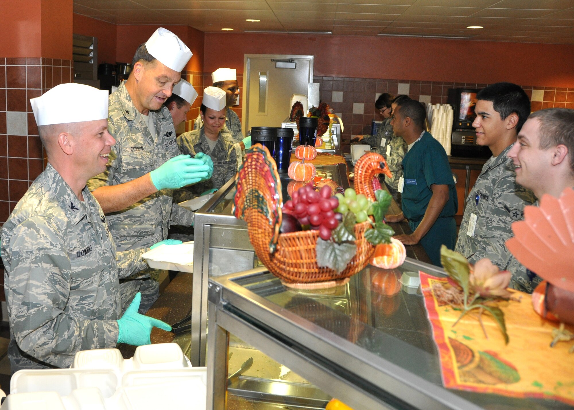 Members of the 81st Medical Group senior staff were joined by Col. Glen Downing, left, 81st Training Wing vice commander, Nov. 16 as they served a traditional Thanksgiving meal to patrons of the 81st Diagnostics and Therapeutics Squadron cafeteria.  Working “the line” with Colonel Downing are, from left, Brig. Gen. (Dr.) Kory Cornum, 81st MDG commander; Col. David Garrison, 81st MDG deputy commander; and Chief Master Sgts. Deborah Strickland, 81st Surgical Operations Squadron superintendent; and Michael Anderson, 81st MDG superintendent.  Other staff members helped out throughout the 11 a.m.-1 p.m. meal period.  The 81st MDTS Nutritional Medicine Flight staff prepared 340 pounds of turkey, 95 pounds of ham and 200 servings of stuffing plus assorted desserts enjoyed by more than 600 customers. (U.S. Air Force photo by Steve Pivnick)
