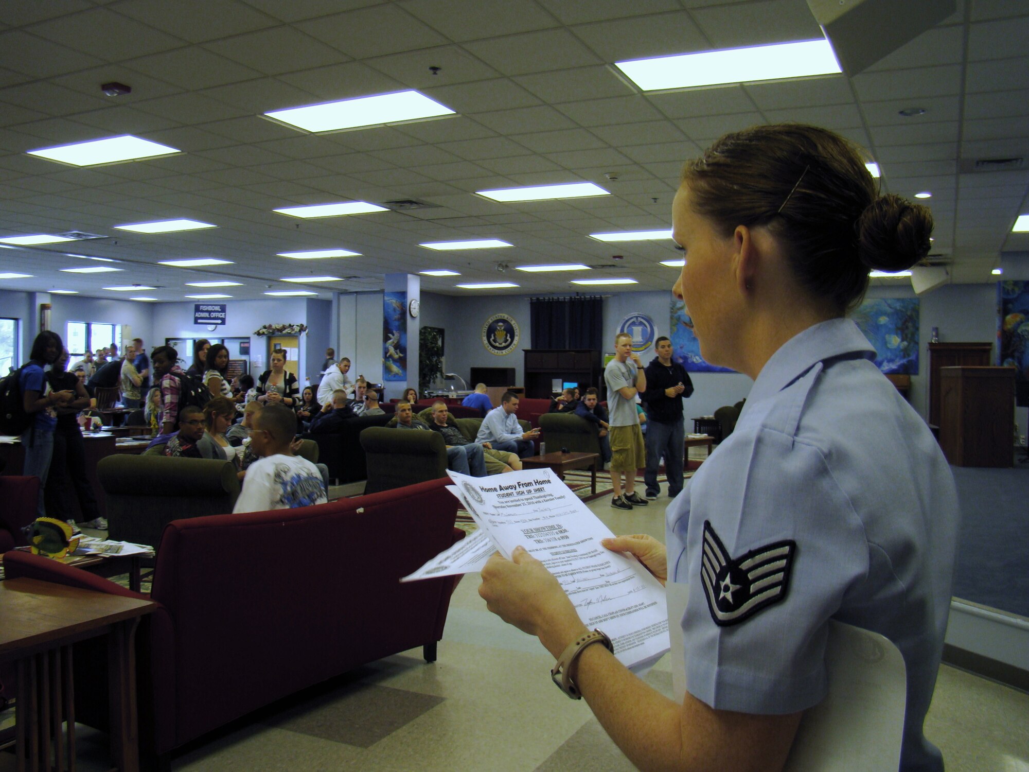 Staff Sgt. Tawny Crutcher from the chapel staff pairs students with their host families on Thanksgiving Day at the Fishbowl Student Center.  This year’s Home Away from Home program saw a record number of students and host families participating — 74 host families and 246 students, up from 235 students in 2009.  The chapel program seeks to bring a bit of home into the lives of nonprior service students at Keesler during Thanksgiving. Many of the families who welcome students into their homes are retired military.  “I believe this is why families are so eager to open their homes,” said Chaplain (Capt.) Ruben Covos. “They’ve been there and want to make it better for upcoming Airmen.” (U.S. Air Force photo by Airman 1st Class Heather Holcomb)