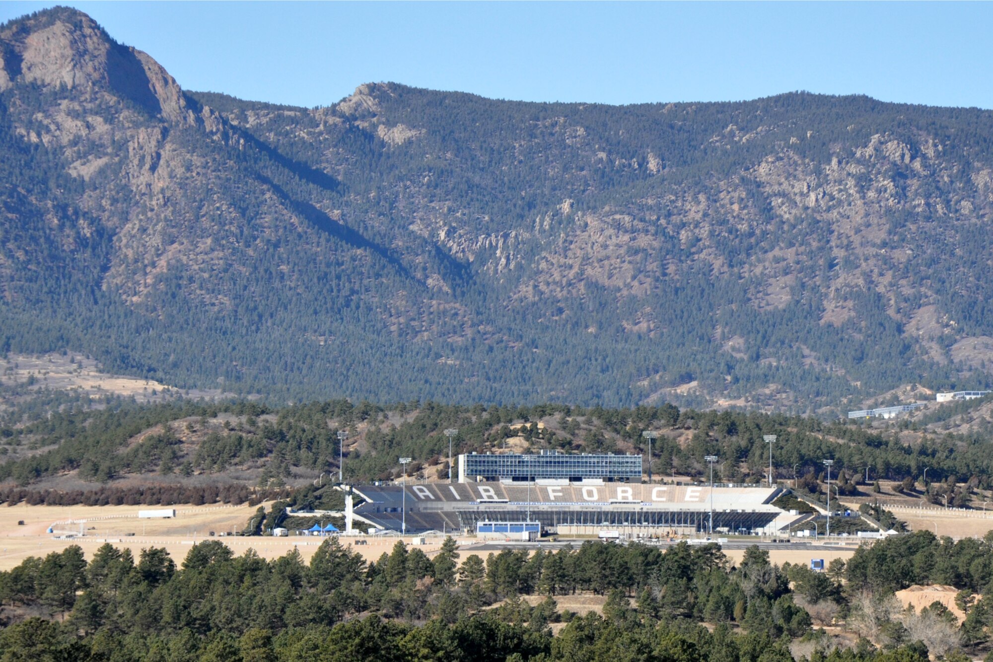 A view of Falcon Stadium at the U.S. Air Force Academy, from Interstate 25 , just north of Colorado Springs, Colo., Nov. 19, 2010. Falcon Stadium opened in 1962, at a cost of $3.5 million, and has a current seating capacity of 52, 480. The stadium was built into a natural bowl southeast of the center of the academic campus.  Like the rest of the campus, Falcon Stadium lies at the base of the Rampart Range of the Rocky Mountains. The design of the stadium is unbalanced, with the western side having two large grandstand tiers above the main bowl and the eastern having a single tier bordered by seven separate sections of grandstands. For more information about tours of the U.S. Air Force Academy, call the Visitors Center at 719-333-2025 or email pa.comrel@usafa.af.mil. (Courtesy photo/Jeff Walston)
