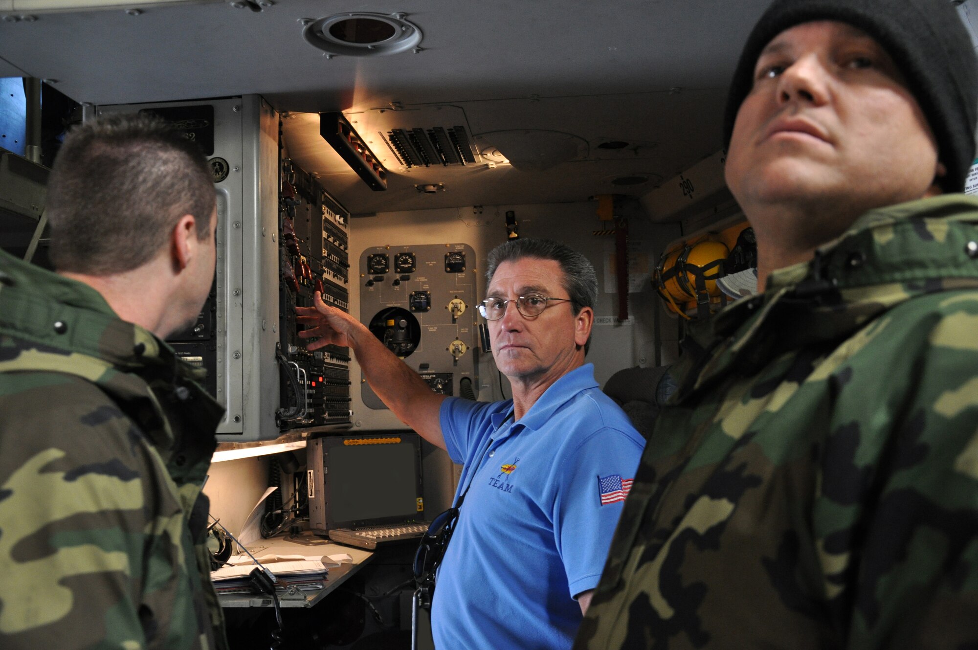 WRIGHT-PATTERSON AIR FORCE BASE, Ohio – Mr. Charles Gibson, 97th Air Mobility Wing, trains Tech. Sgt. Thomas Graham and Master Sgt. John Cummings, 445th Maintenance Group, on the C-17 Globemaster III. (U.S. Air Force Photo/ Staff Sgt. Amanda Duncan)