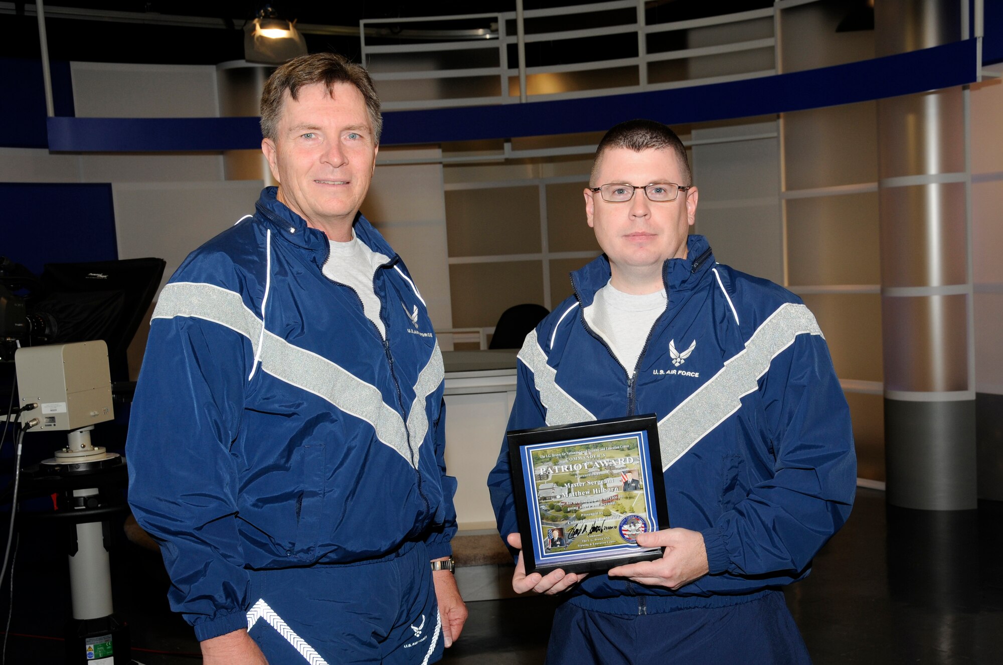 McGHEE TYSON AIR NATIONAL GUARD BASE, Tenn. - Col. Richard B. Howard, left, commander of The I.G. Brown Air National Guard Training and Education Center here, presents his Patriot Award to Master Sgt. Matt Hilborn, right, broadcast manager for the TEC-TV studios, for recognition of his contributions to the center, Nov. 24, 2010. The Patriot Award is Howard's personal award to show appreciation for those he feels have gone above and beyond in their service. (U.S. Air Force photo by Master Sgt. Kurt Skoglund/Released)