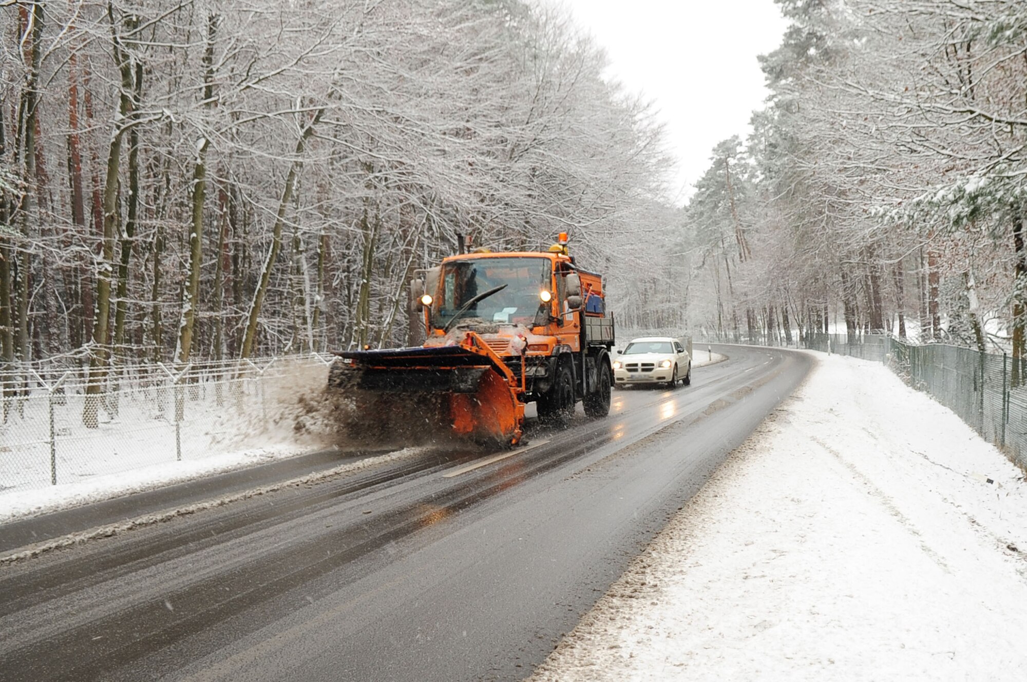 A snow plower plows the roads, Ramstein, Germany, Nov. 29, 2010. The purpose of snow plowing is to help maintain safe driving conditions on roads throughout the Kaiserslautern Military Community. (U.S. Air Force photo by Senior Airman Brittany Nicole Perry)