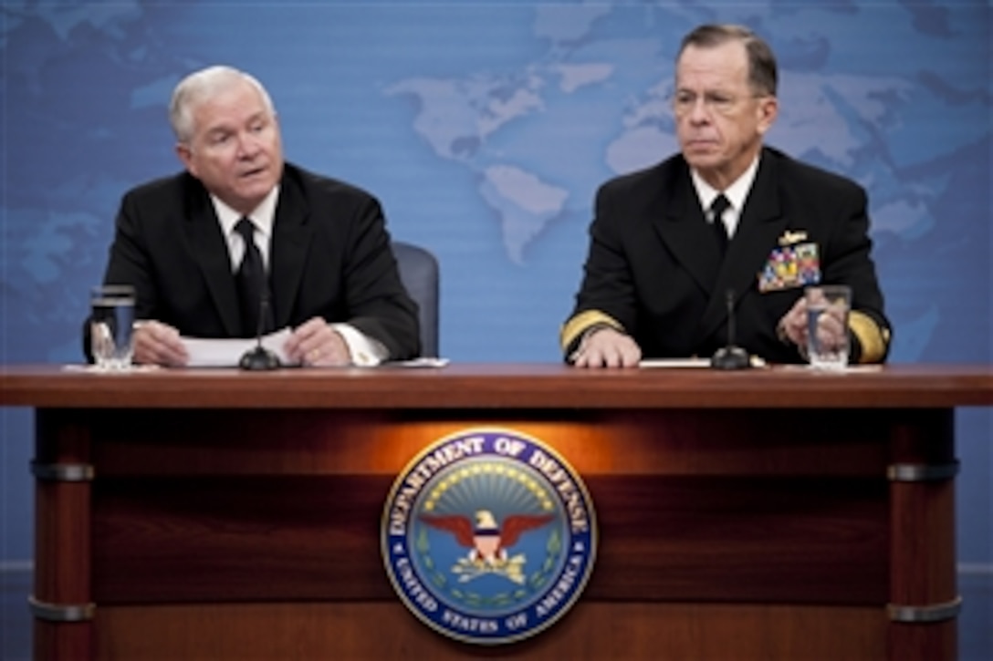 Defense Secretary Robert M. Gates and Navy Adm. Mike Mullen, chairman of the Joint Chiefs of Staff, conduct a press briefing at the Pentagon discussing the public release of the "Don't Ask, Don't Tell" Comprehensive Working Group report, Nov. 30, 2010.