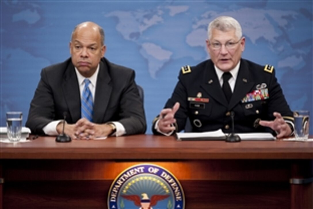 Department of Defense General Counsel Jeh C. Johnson and U.S. Army Gen. Carter Ham conduct a press briefing at the Pentagon discussing the public release of the "Don't Ask, Don't Tell" Comprehensive Working Group report, Nov. 30, 2010.