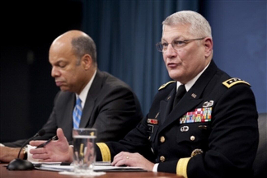 Department of Defense General Counsel Jeh C. Johnson and U.S. Army Gen. Carter Ham conduct a press briefing in the Pentagon discussing the public release of the "Don't Ask, Don't Tell" Comprehensive Working Group report on Nov. 30, 2010.  