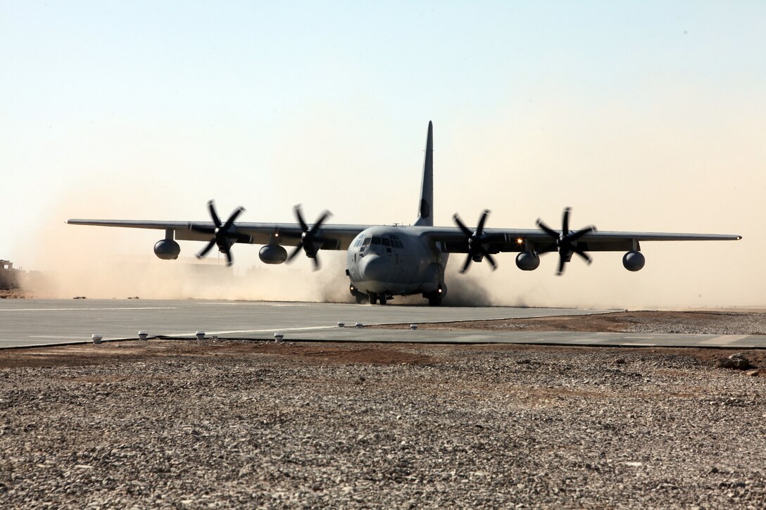 The first KC-130J “Hercules” to land at Forward Operating Base Delaram II arrived Nov. 30.  The runway was constructed by a small detachment of Marine Wing Support Squadron 373 Marines, who were present to view the fruits of their labor.  In a total of 66 days, the Marines of MWSS-373 lifted and slammed over 1.2 million square feet of airfield matting, which averaged 2,500 pieces laid per Marine; moved and spread over 225,000 cubic meters of dirt and gravel and reviewed more than 7,800 drafting and surveying points. These are just a few of the vast accomplishments made by the small detachment of Marines and sailors who contributed to the runway project.