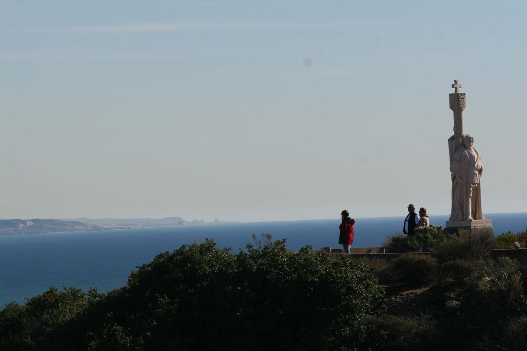 Visitors enjoy the view near the Juan Rodriguez Cabrillo statue at the Cabrillo National Monument here Nov. 30. The statue overlooks the San Diego Bay and is a reminder of Cabrillo's exploration accomplishments.