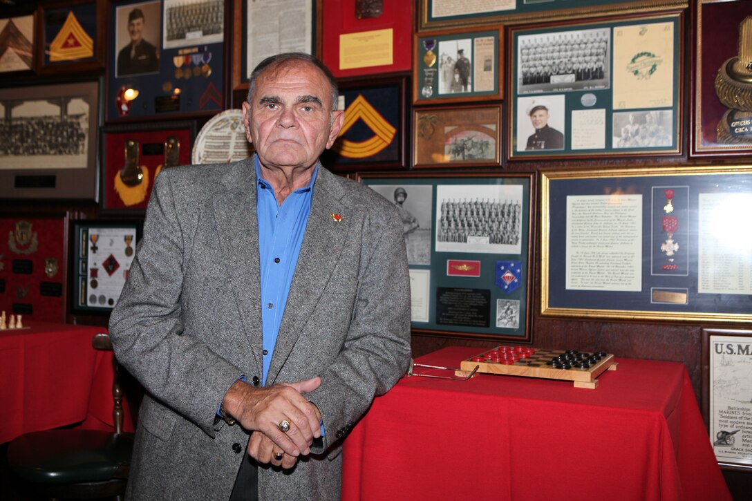 Retired Sgt. Maj. Ihor Sywanyk, the owner of Sywanyks Scarlet and Gold Traditions, an establishment located in Jacksonville, N.C., poses for a photo during the Big Dog Reception, Oct. 1.  The event was open to all staff noncommissioned officers – both past and present – from any branch of military service.