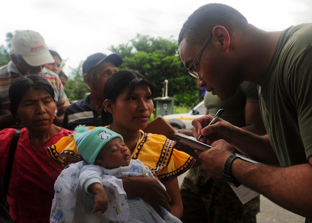 Cpl. Hector Reyes, from New York assigned to Special Purpose Marine Air-Ground Task Force embarked aboard the multi-purpose amphibious assault ship USS Iwo Jima (LHD 7), checks patients into a Continuing Promise 2010 medical community service event. Iwo Jima is supporting the Continuing Promise humanitarian and civic assistance mission. The assigned medical and engineering staff embarked aboard Iwo Jima are working with partner nations to provide medical, dental, veterinary, and engineering assistance in eight countries.::r::::n::